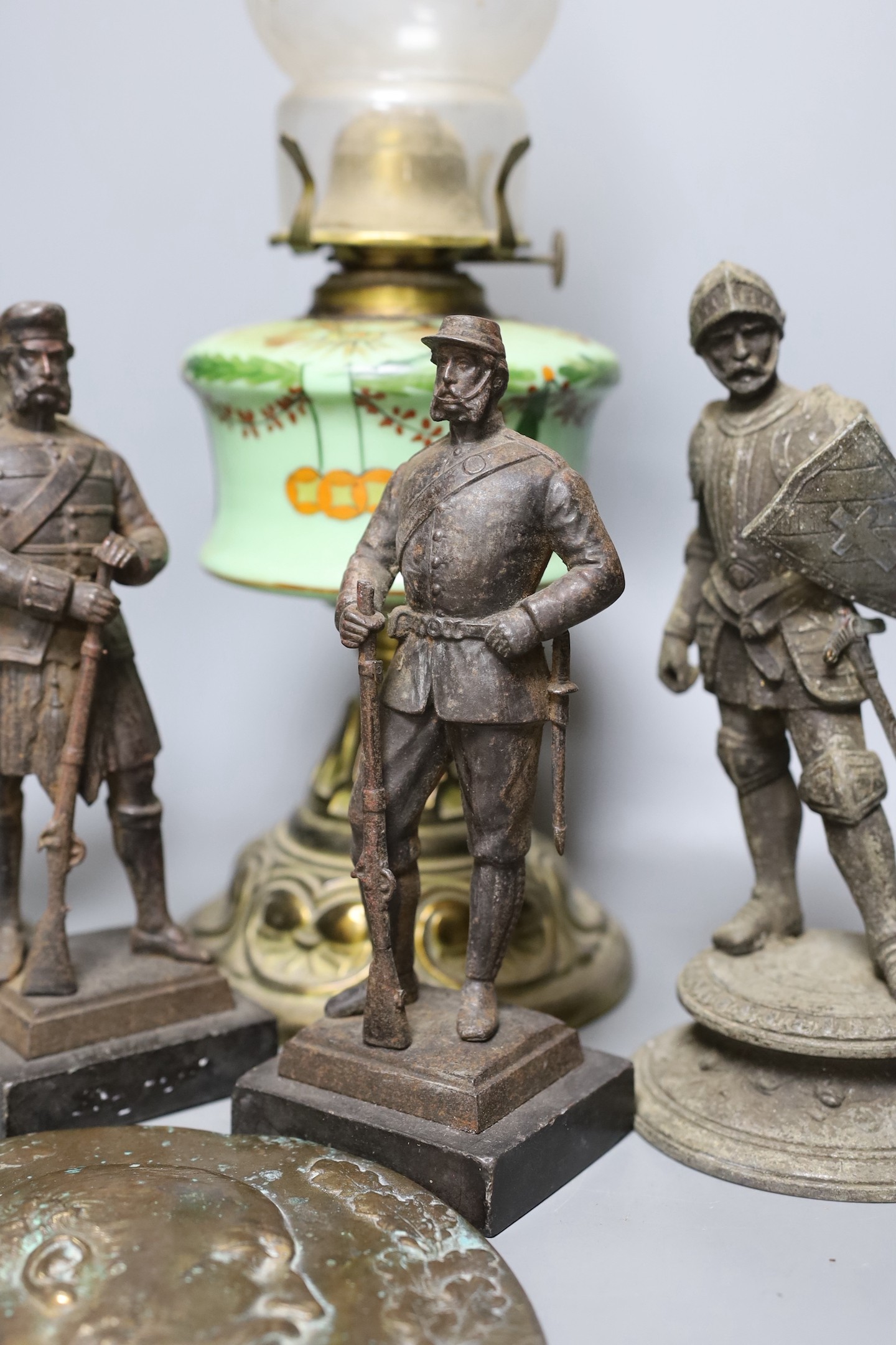 Two pairs of spelter figures, an relief cast portrait plaque, and oil lamp